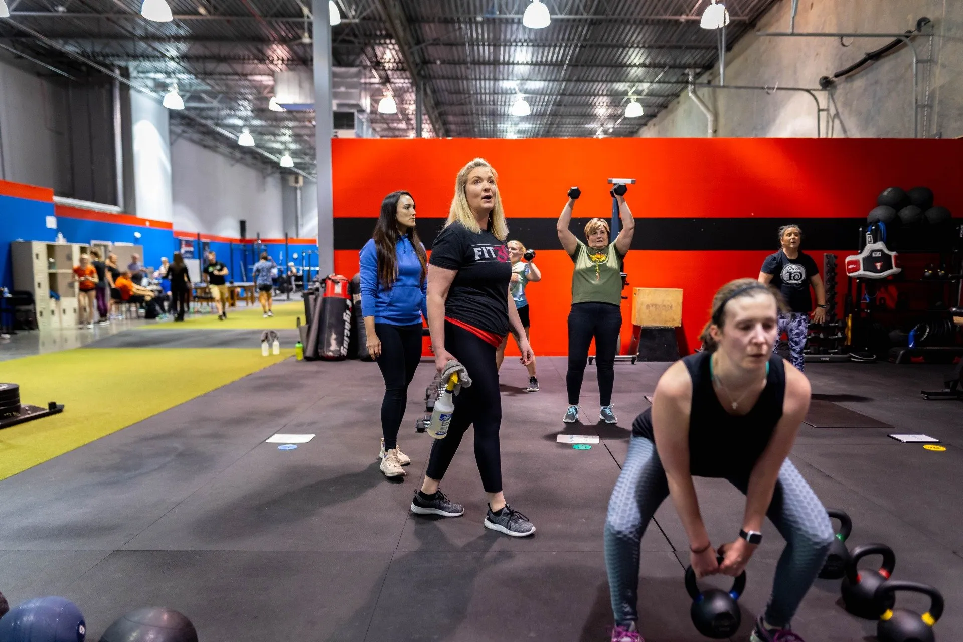 woman using kettle bell training equipment