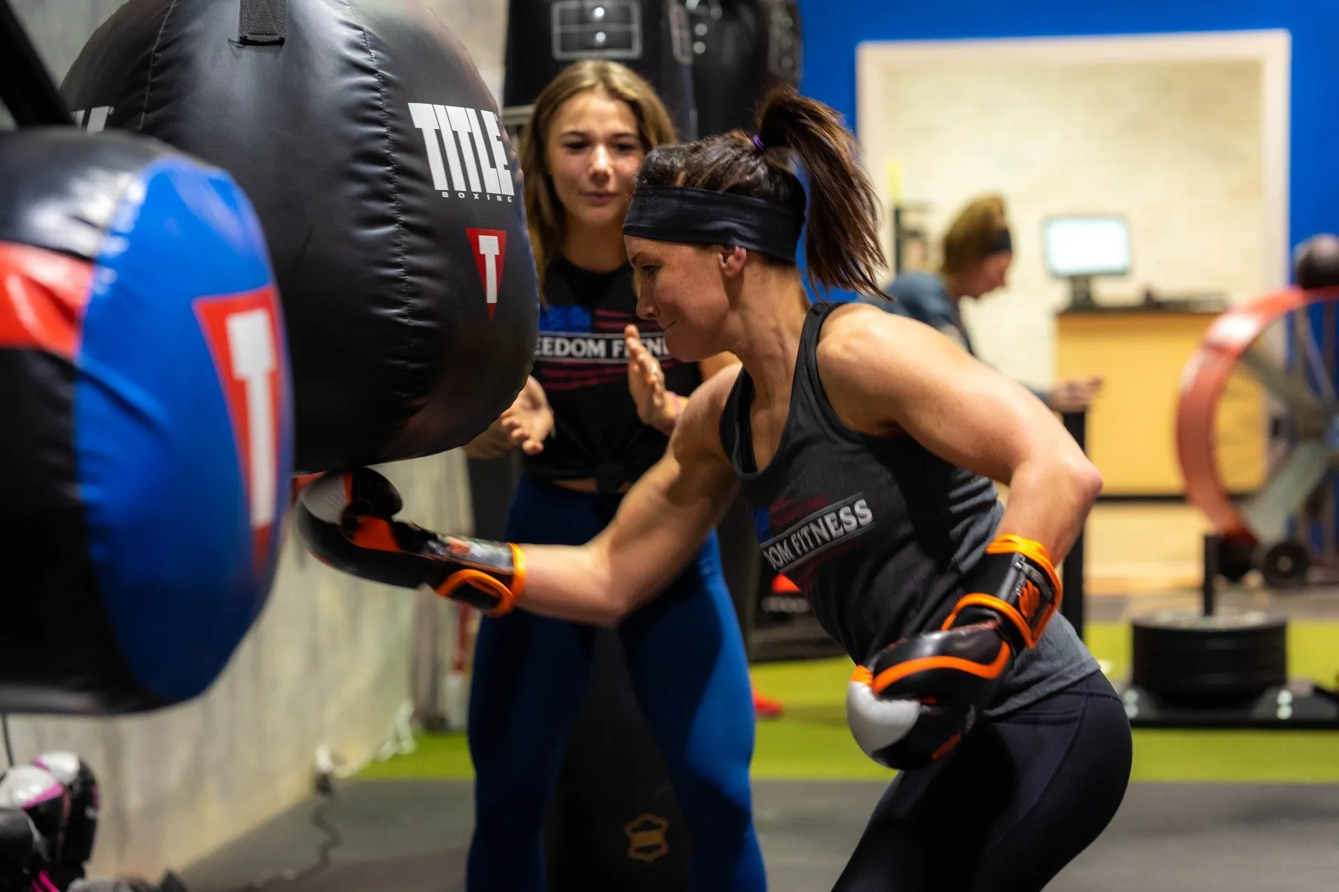 woman doing boxing on a fitness gym