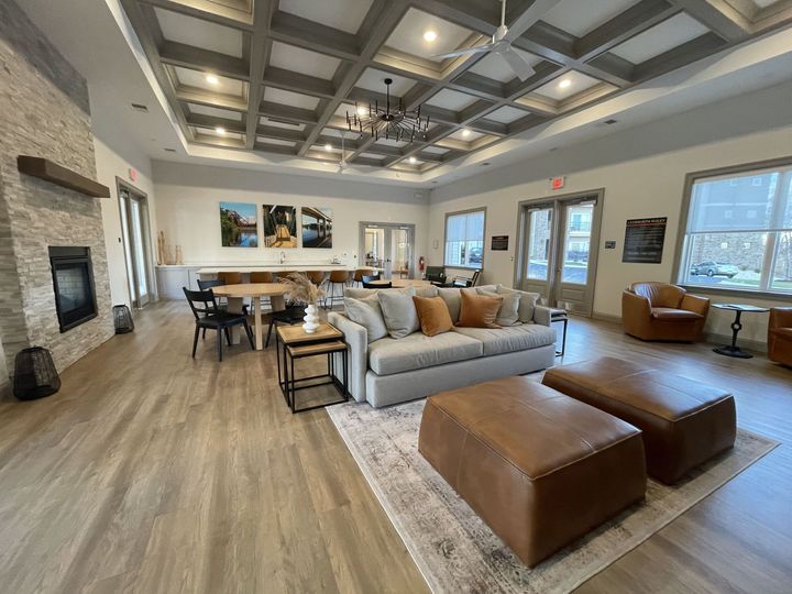 A large living room filled with furniture and a fireplace.