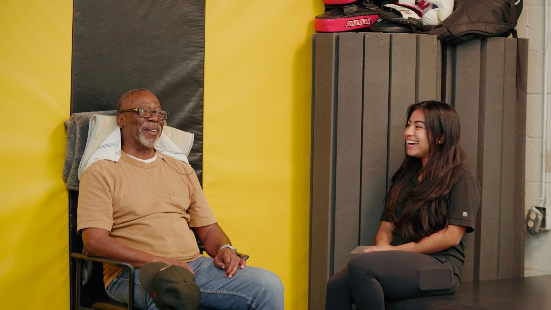 A person receiving a neck adjustment from a healthcare professional in a clinic.