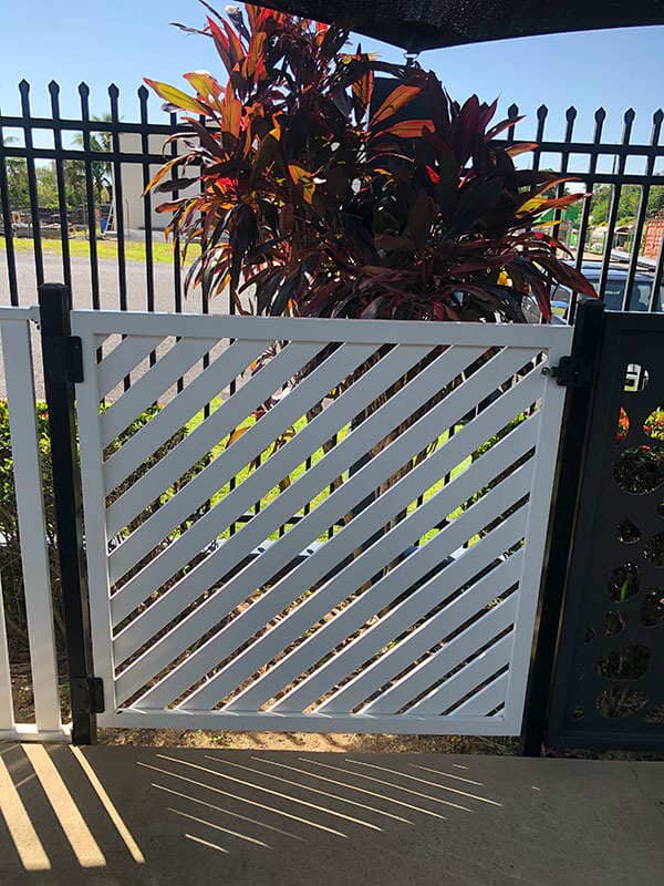 White lattice styled automatic gate - gate automation Cairns, QLD