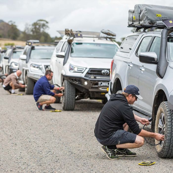 Man Repairing The 4x4 Tyres — 4WD Accessories In Ashmont, NSW