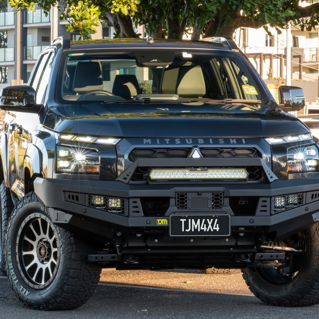 Black Mitsubishi Truck With Custom Front Bumper — TJM Wagga Wagga In Ashmont, NSW