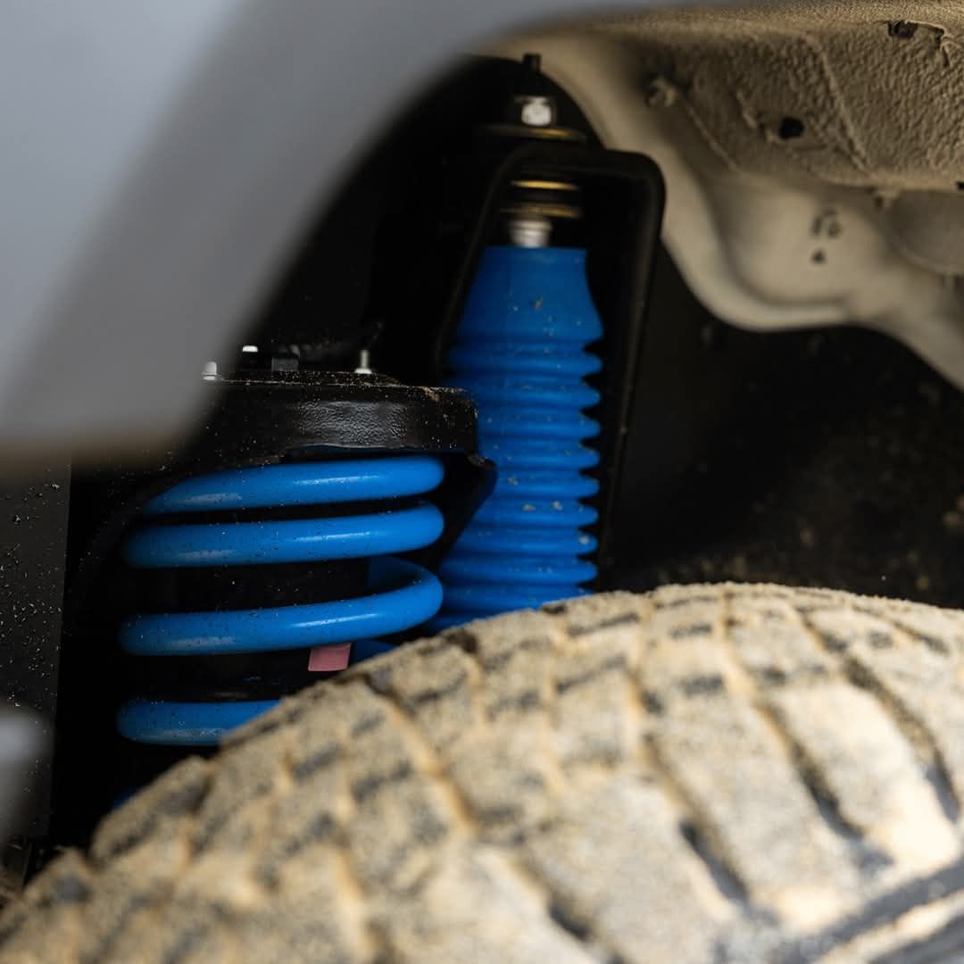 Blue Coil Spring and Shock Absorber Visible — TJM Wagga Wagga In Ashmont, NSW 