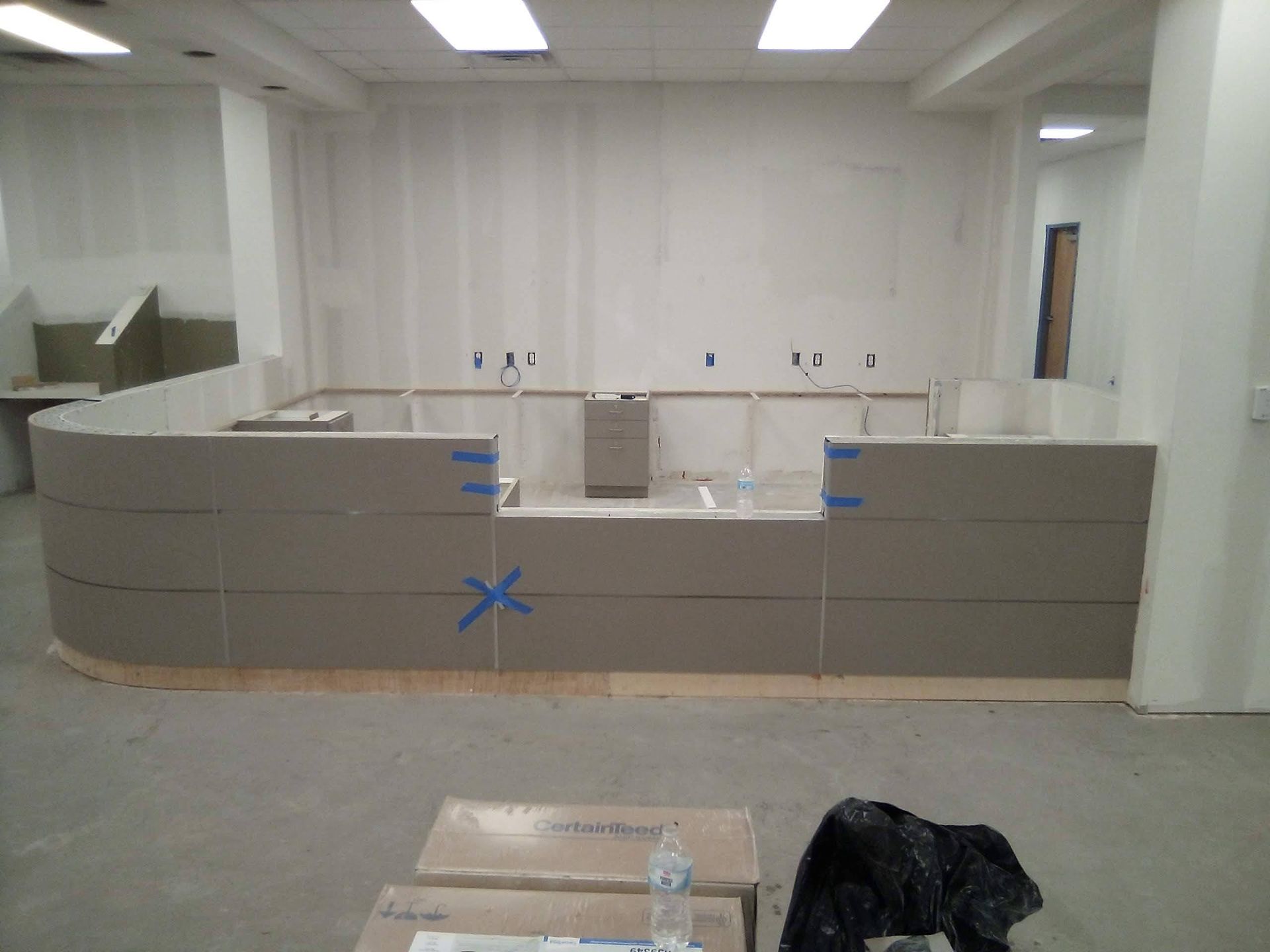 A room that is being remodeled with boxes on the floor