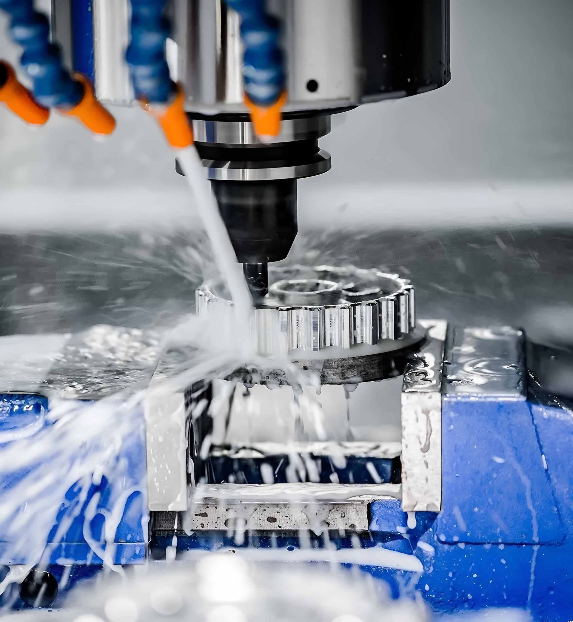 A Machine Is Cutting A Piece Of Metal With Water Coming Out Of It — Wallers Precision Tooling In Paget , QLD