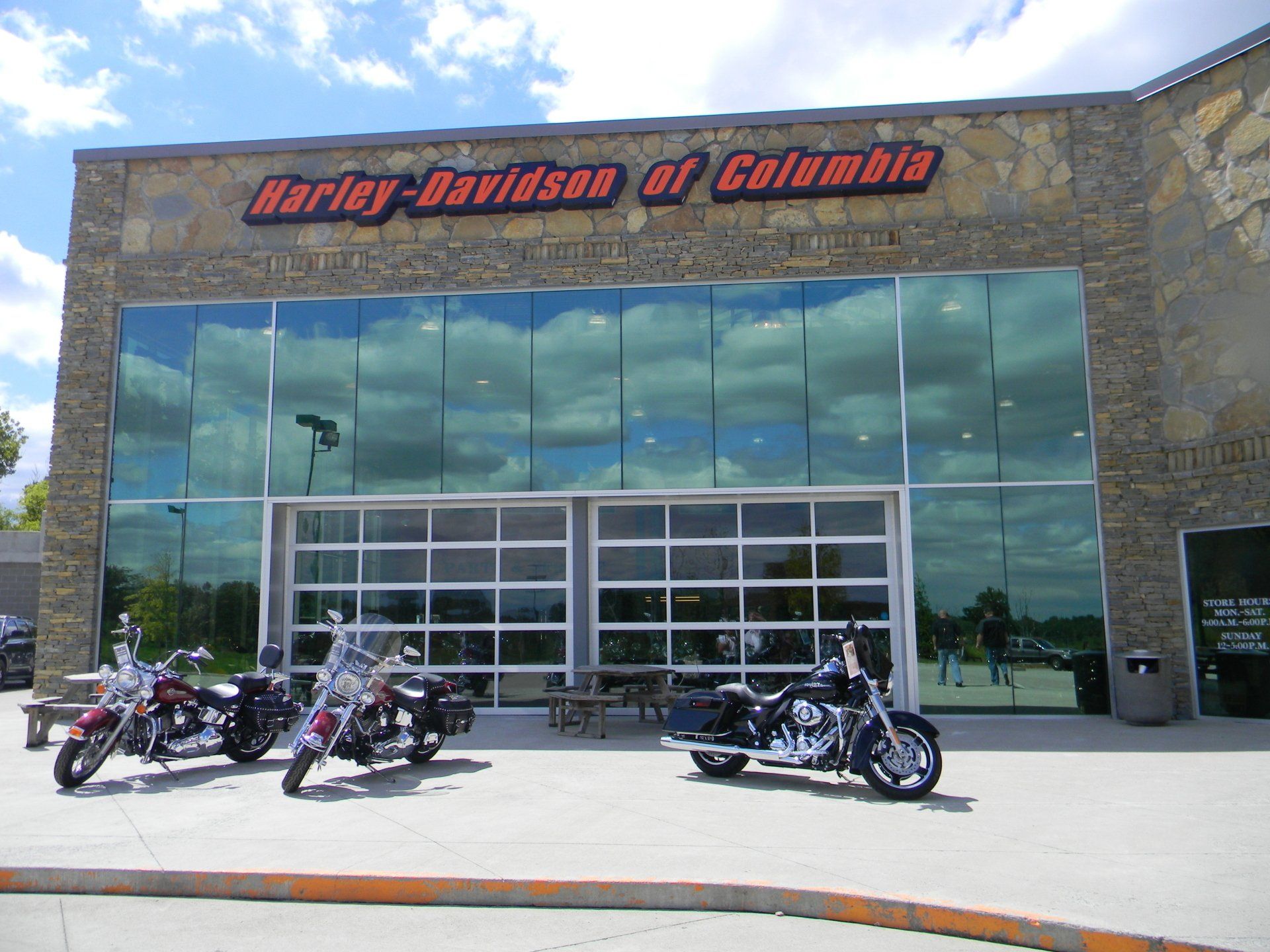 Harley-Davidson of Columbia storefront with motorcycles parked outside on a sunny day.
