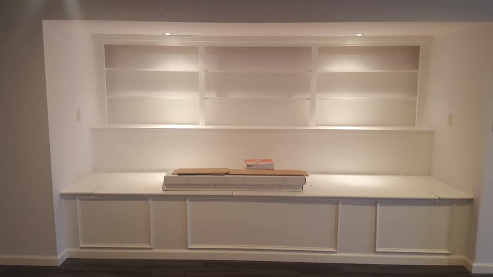 A room with a lot of shelves and cabinets in it.