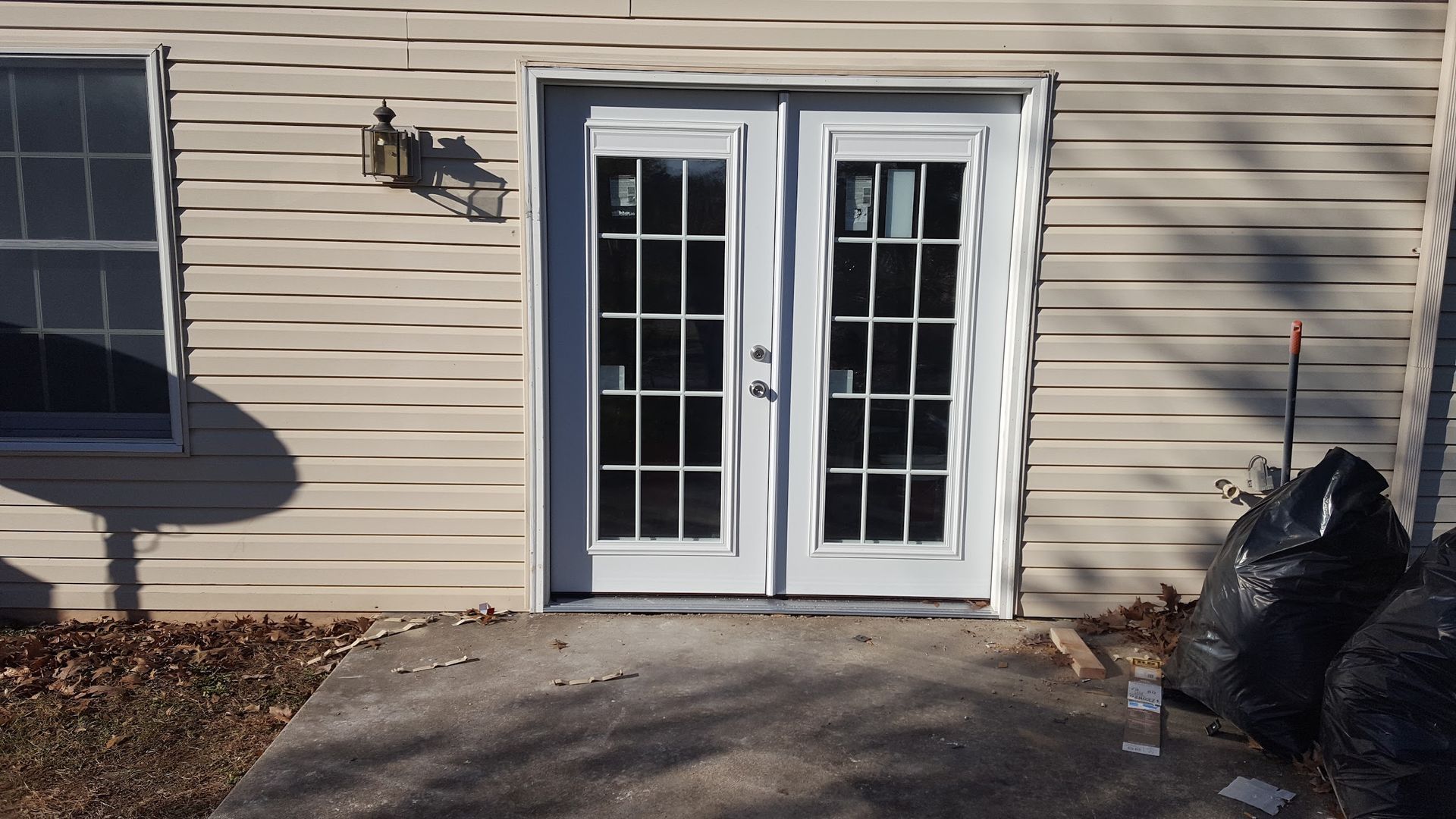 A house with a patio door and two windows
