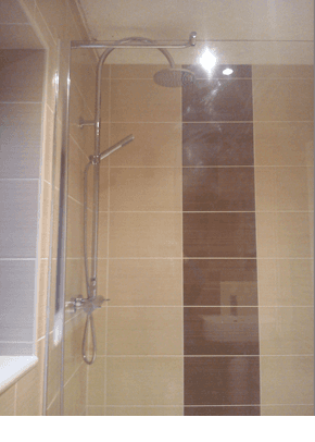 stylish shower with brown and creme tiles