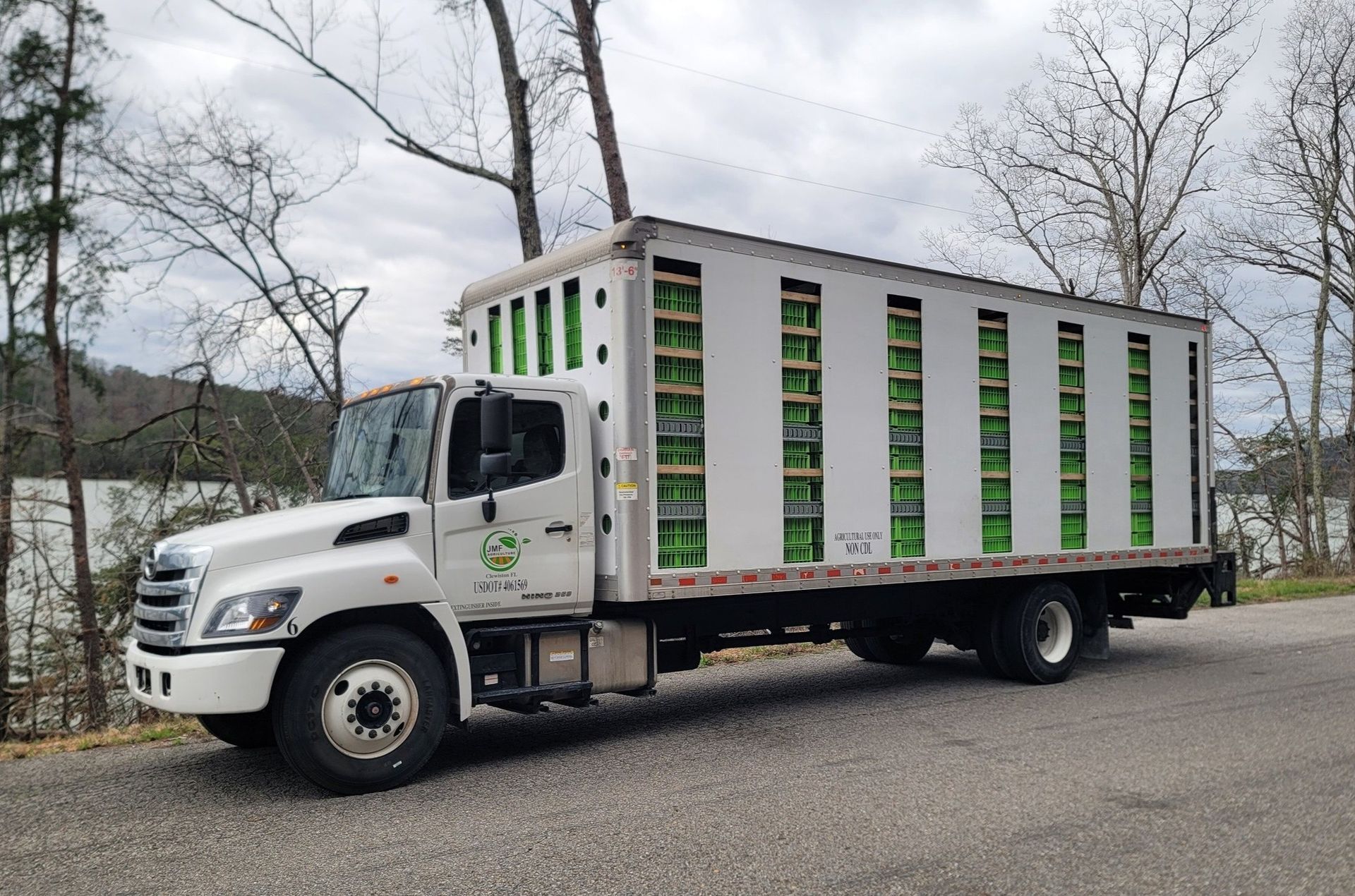 A white truck is parked on the side of the road.