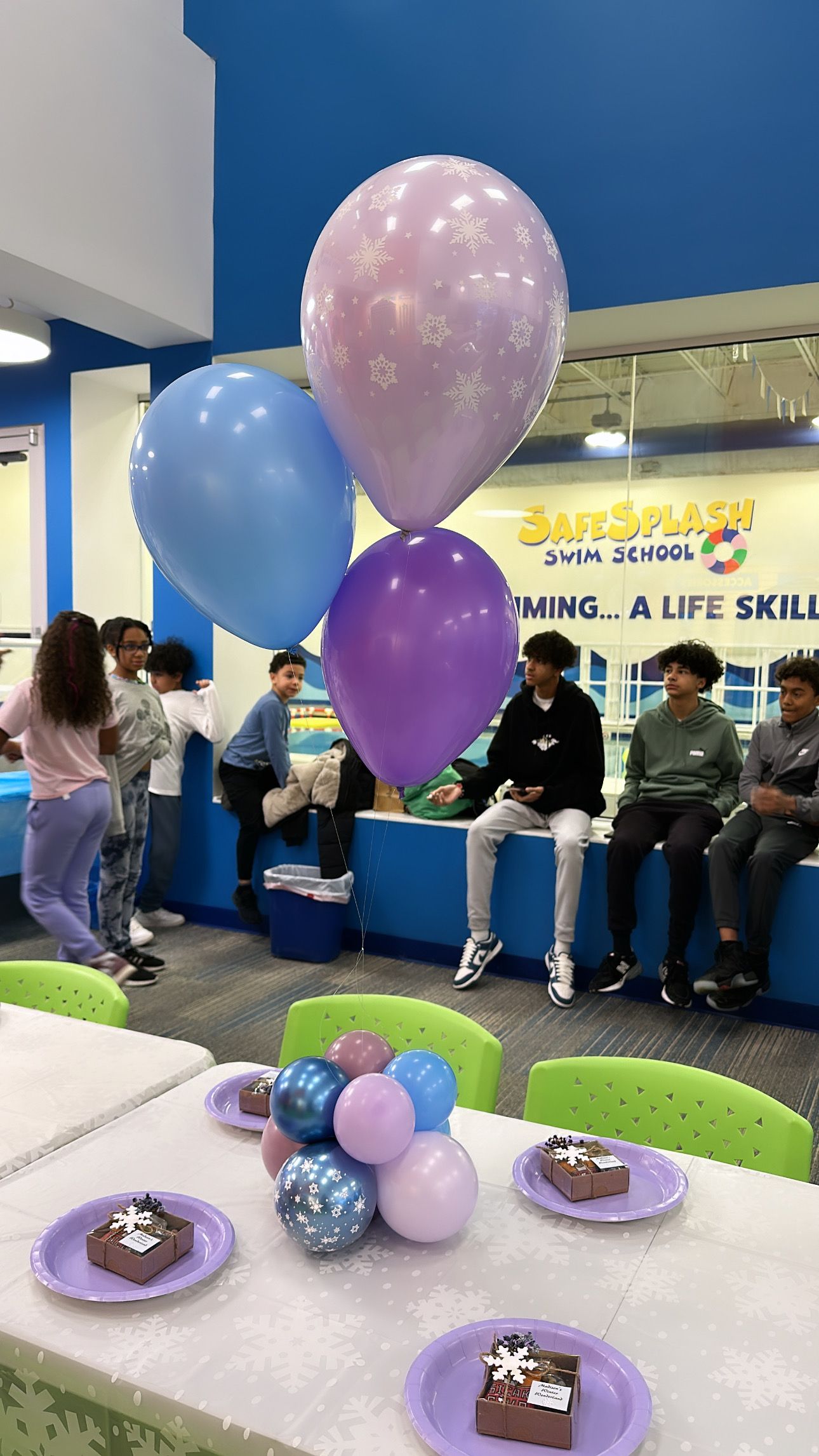 A bunch of balloons are sitting on top of a table.