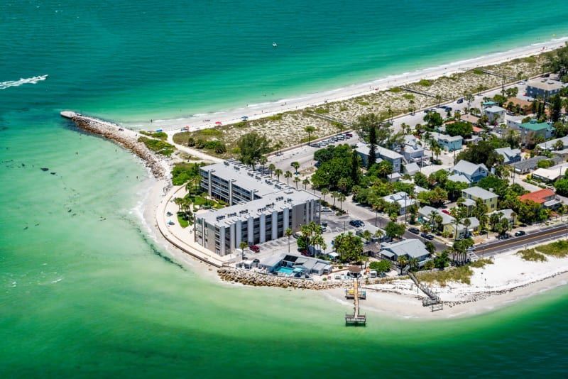 An aerial view of a small island in the middle of the ocean.