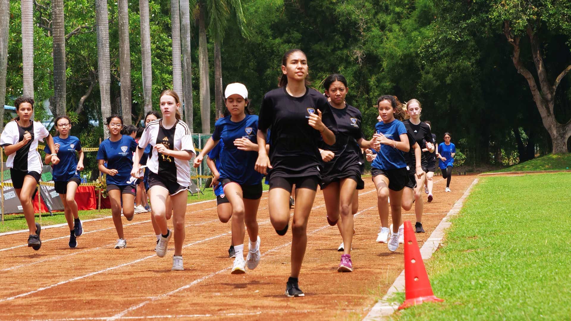 Female students of German School Jakarta running along the track in the 1200m race