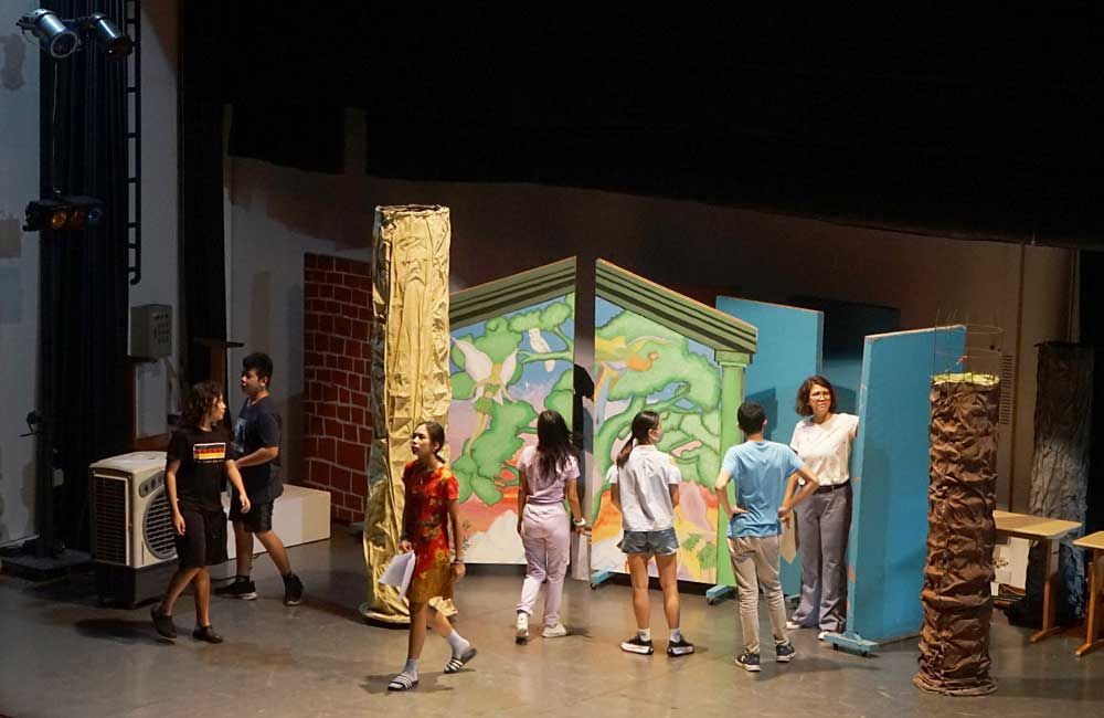 A group of children are standing on a stage.