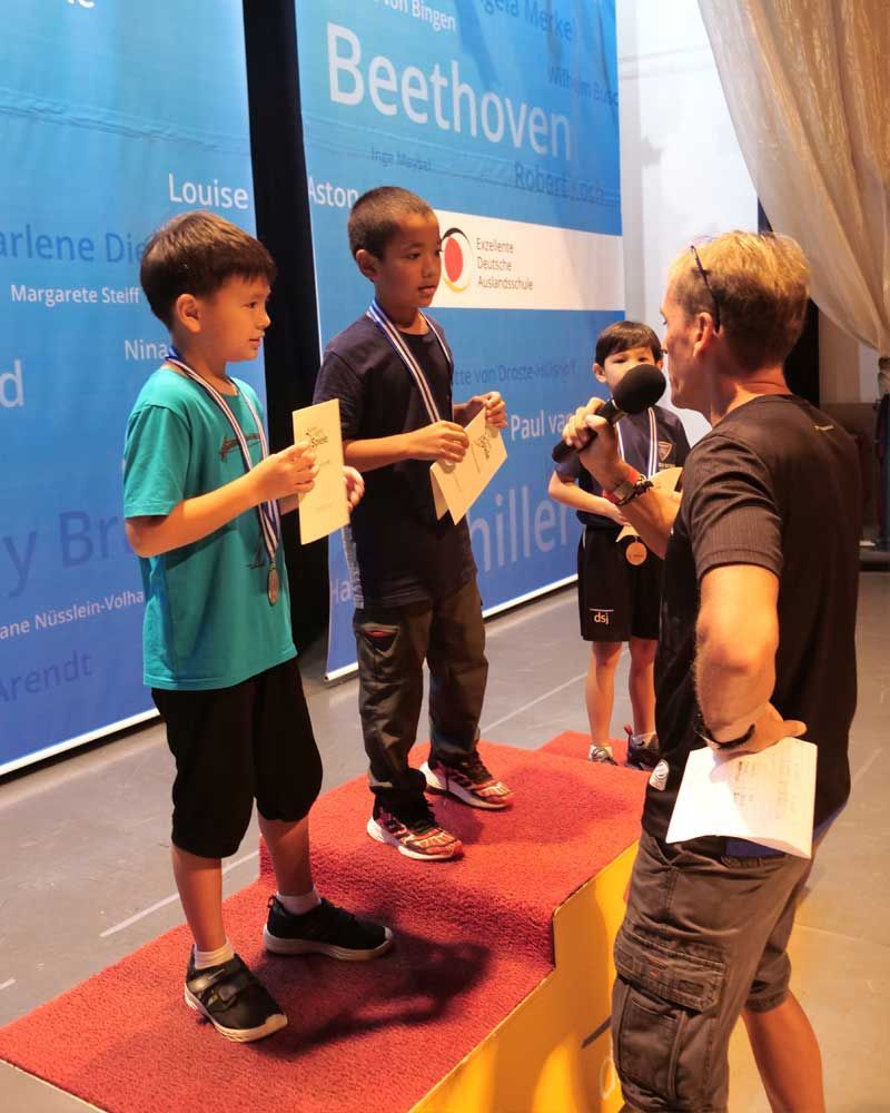 The word beethoven that is on a wall