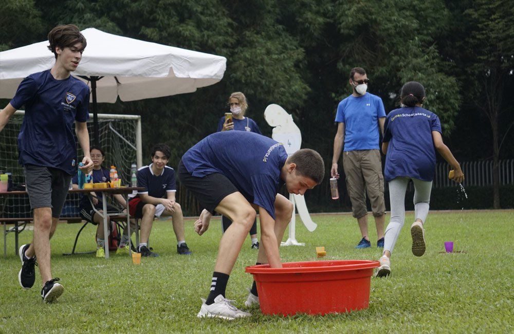 A group of people are playing a game on a field.