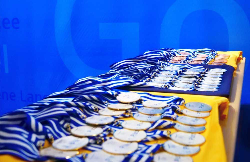 A table with a lot of medals on it