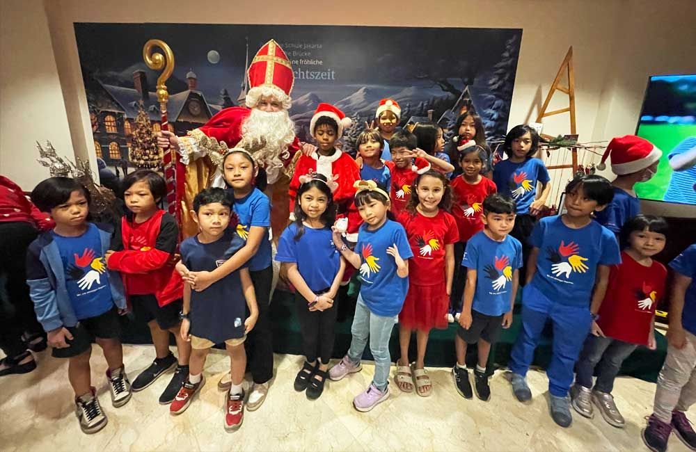 A group of children are posing for a picture with santa claus.