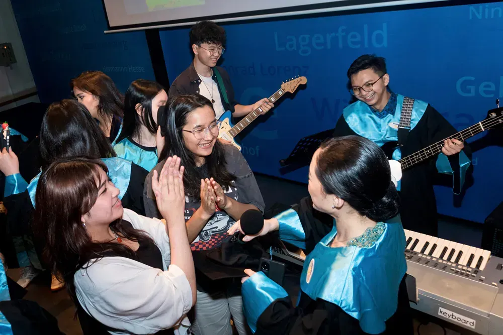 A group of people are playing instruments in a room.