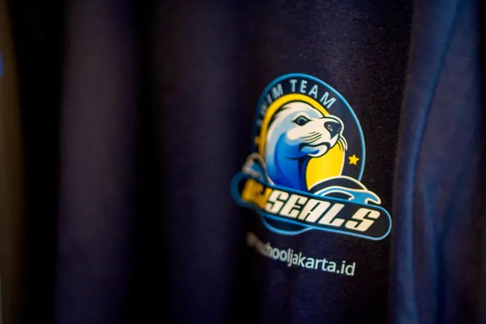 A close up of a shirt with the seals logo on it