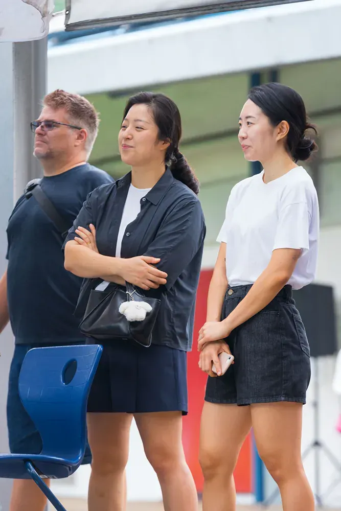 A group of people are standing next to each other.