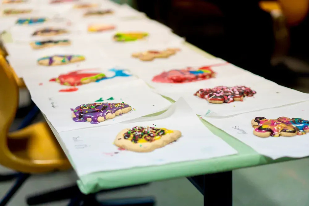 A long table with a bunch of cookies on it