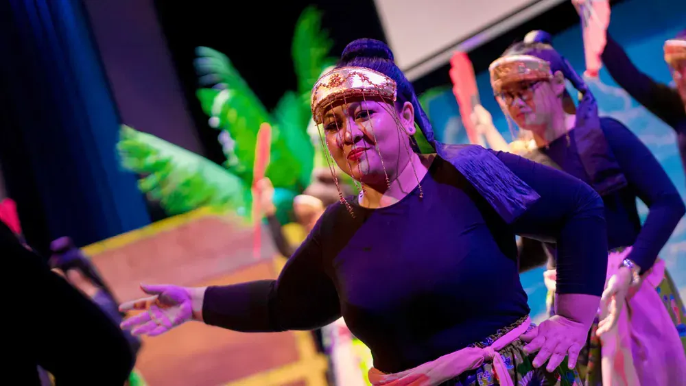 A group of women are dancing on a stage.