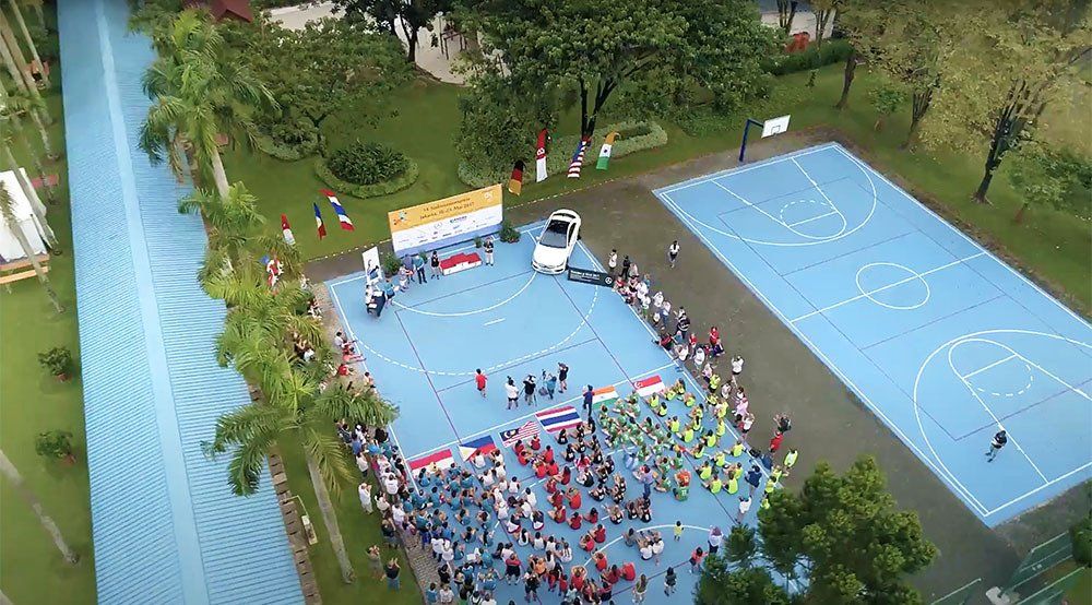 An aerial view of a basketball court filled with people.