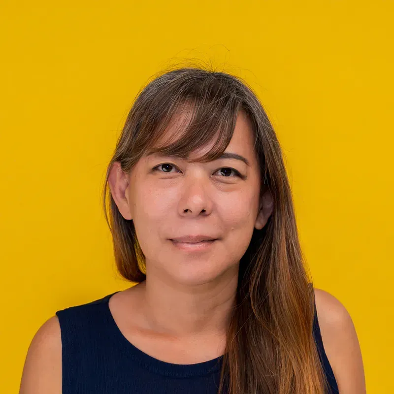 A man with a bald head is smiling for the camera.