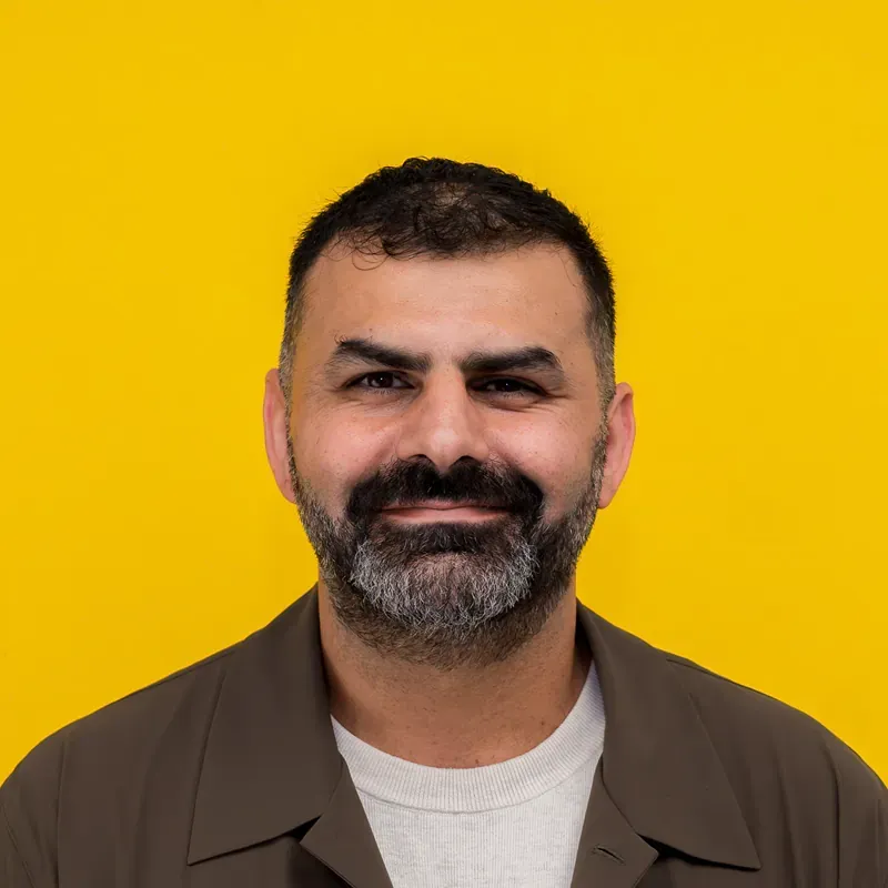 A close up of a woman 's face with a necklace around her neck