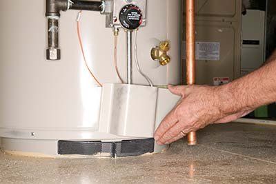 Tank Heater — Man Preparing The Water Heater in Columbus, OH