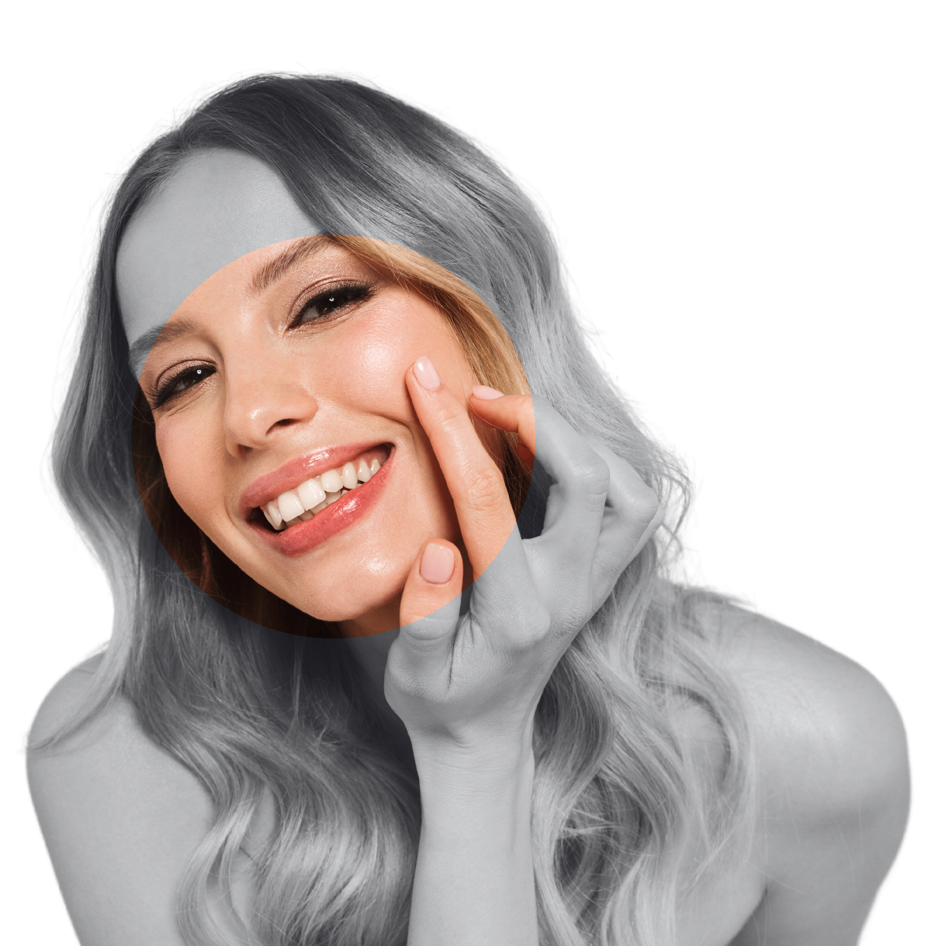 A woman with blonde hair is smiling and touching her face.