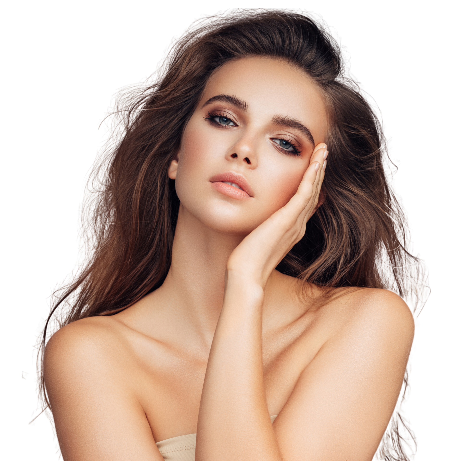 A woman with long hair is holding her hand to her face.