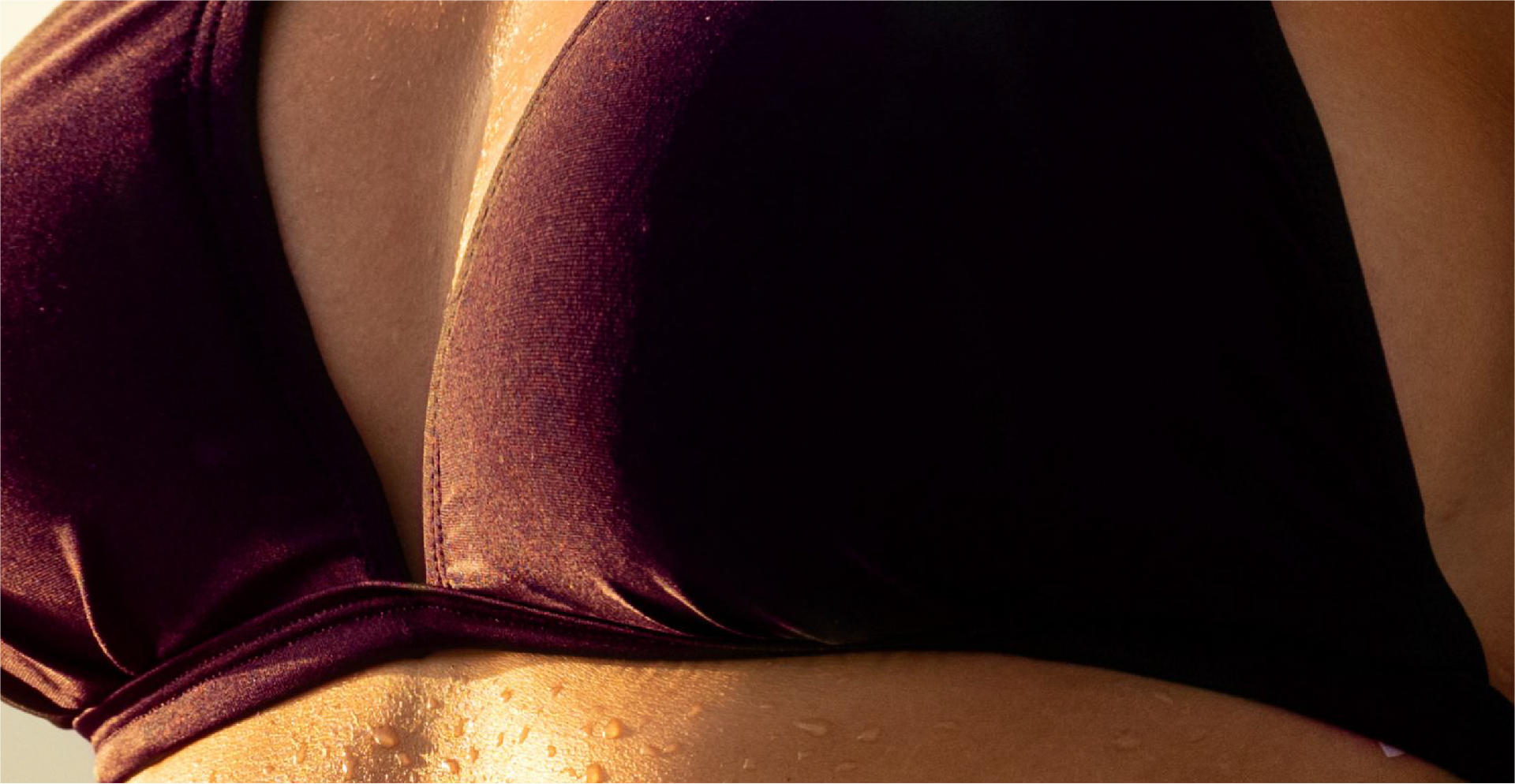 Close up of a woman's body at the beach.