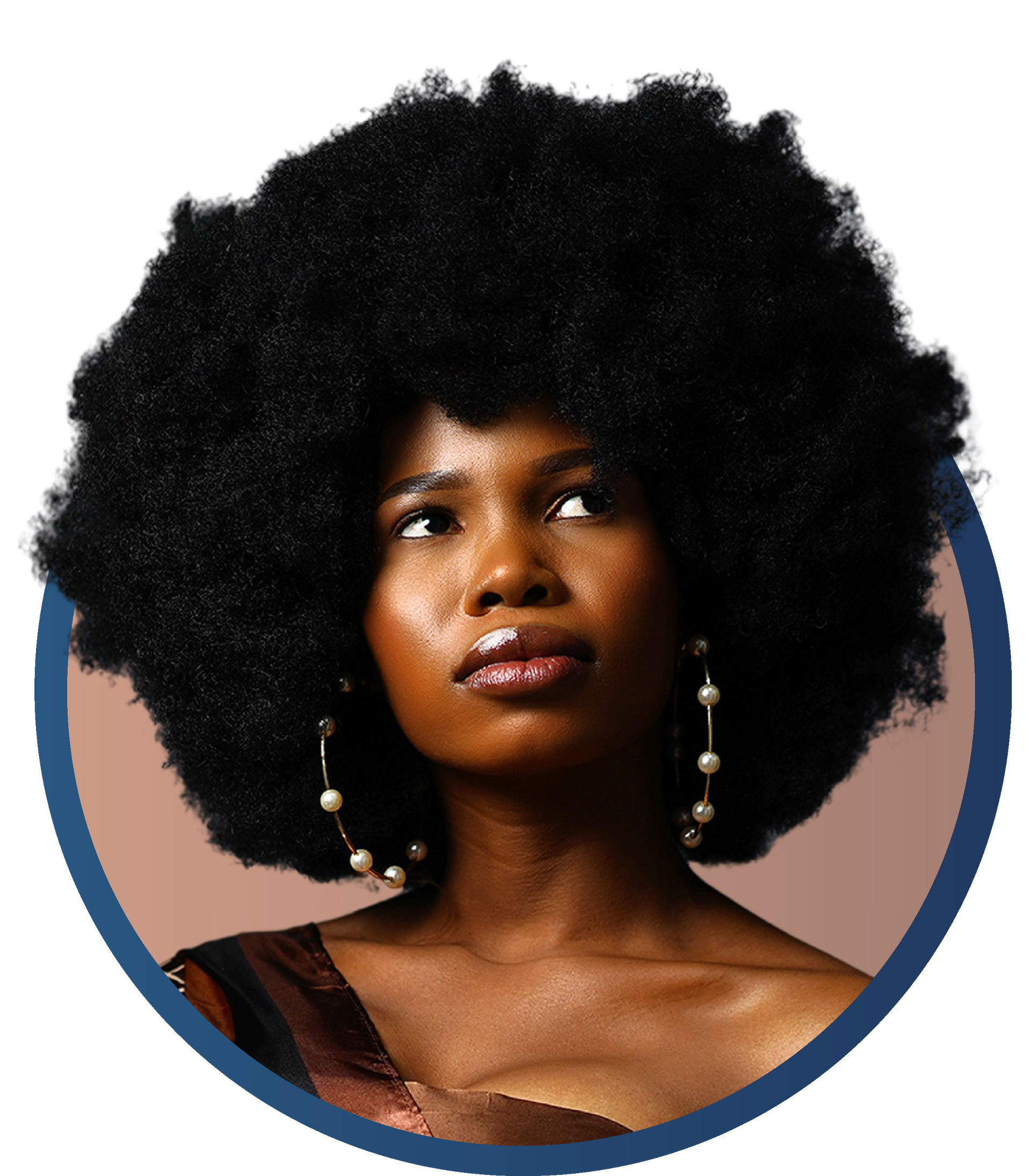 A woman with a large afro and pearl earrings