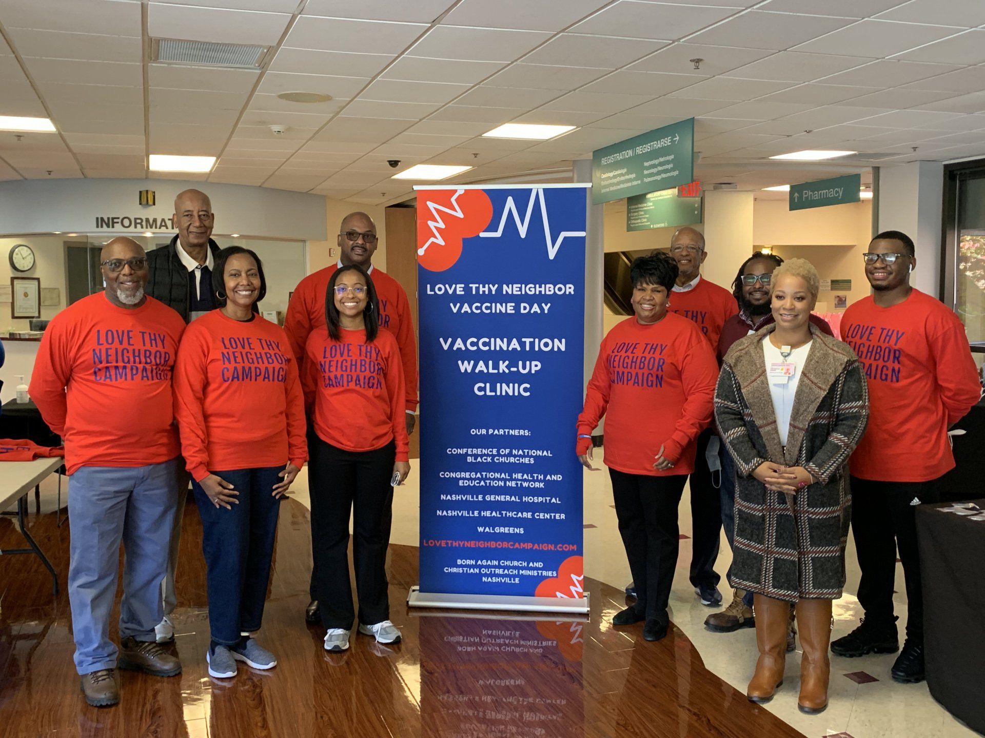Group of People With Vaccination Banner — Nashville, TN — CHEN