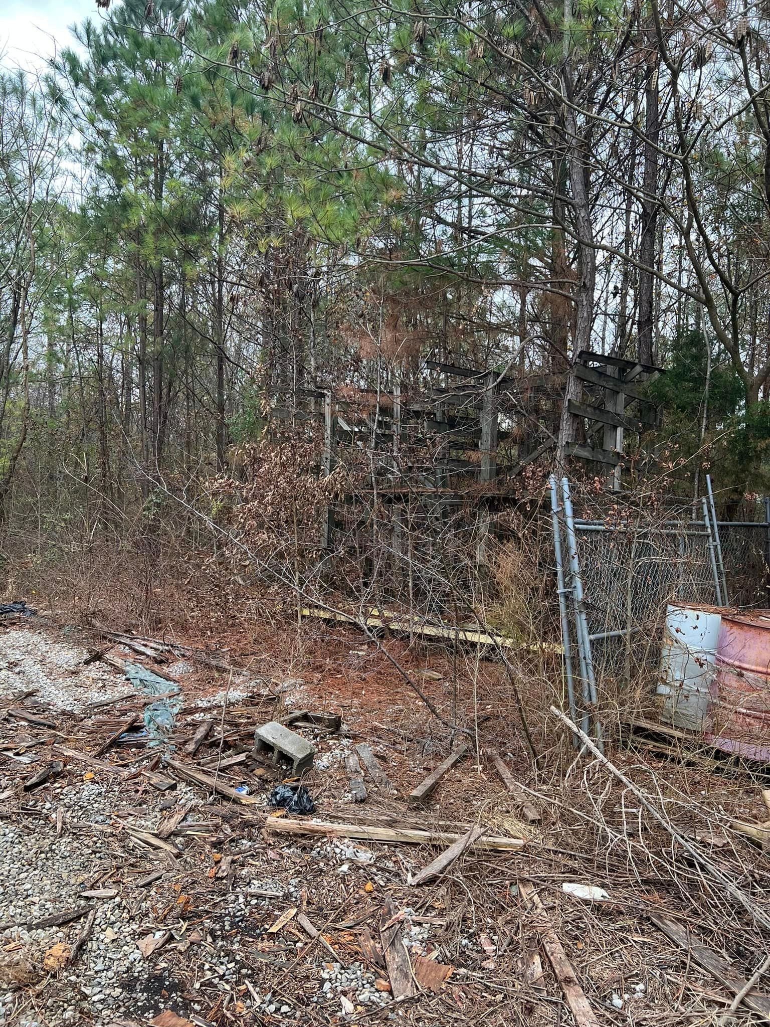 There is a lot of trash in the middle of the woods.