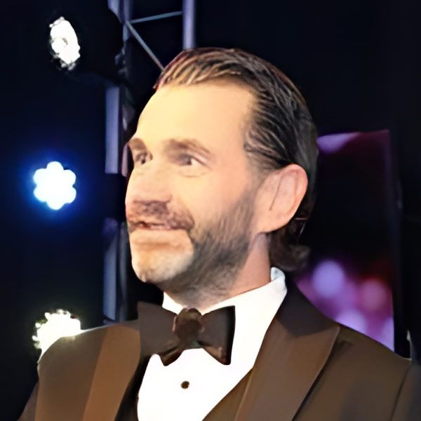 A man in a tuxedo with a bow tie