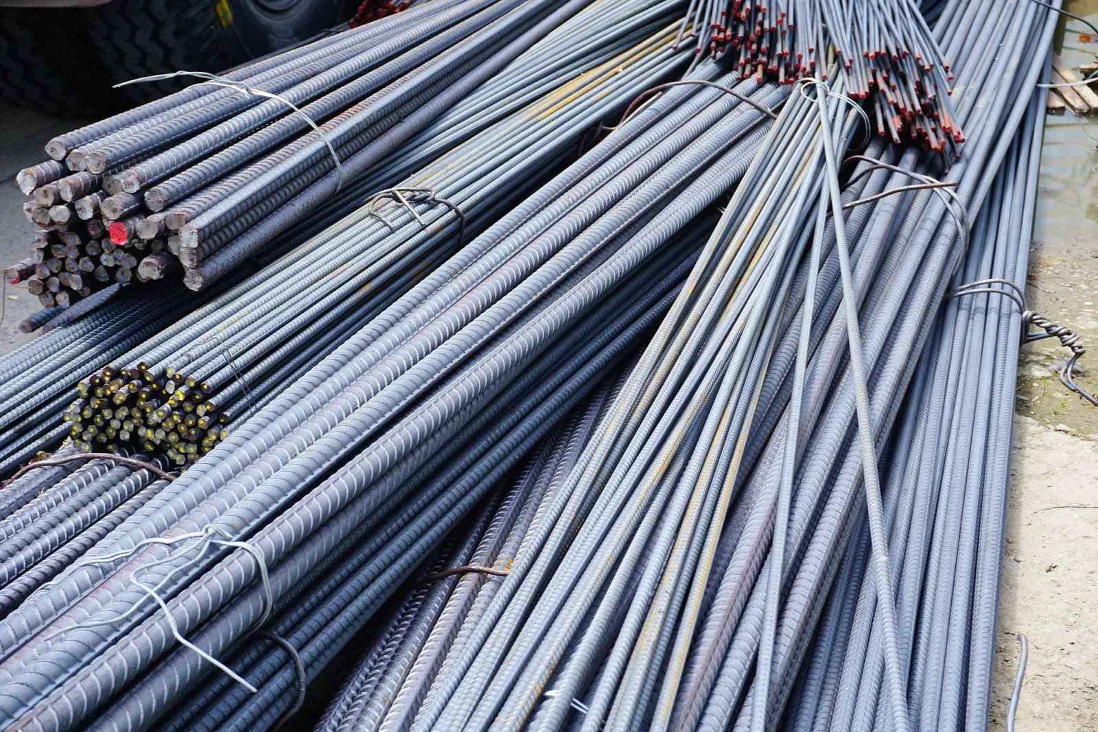 Bundles of steel rebar tied together, likely for construction.