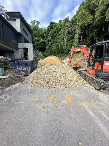 Red Excavators Loading Dirt — Cairns Earthmoving Solutions In Smithfield, QLD