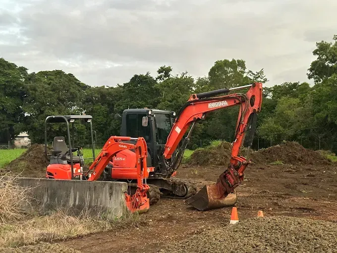 Red excavator — Cairns Earthmoving Solutions In Redlynch, QLD