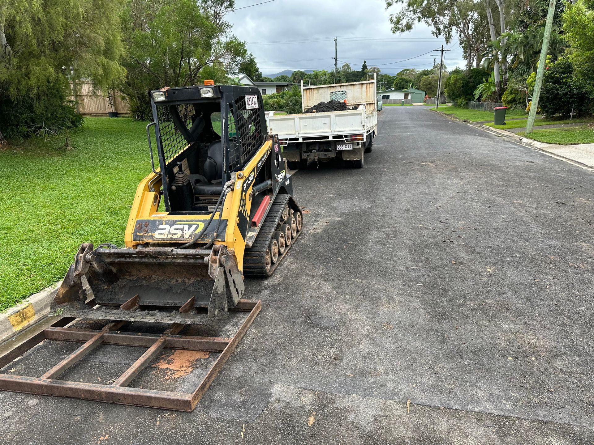 Yellow Bulldozers on side of a road — Cairns Earthmoving Solutions In Redlynch, QLD