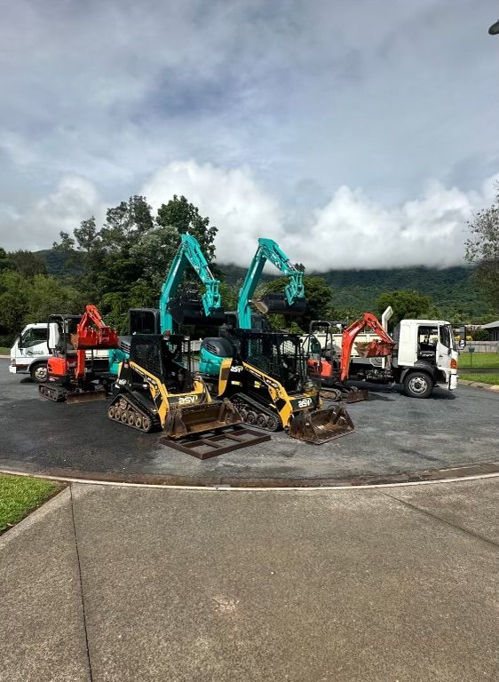 white work truck with excavator in the tray — Cairns Earthmoving Solutions In Redlynch, QLD