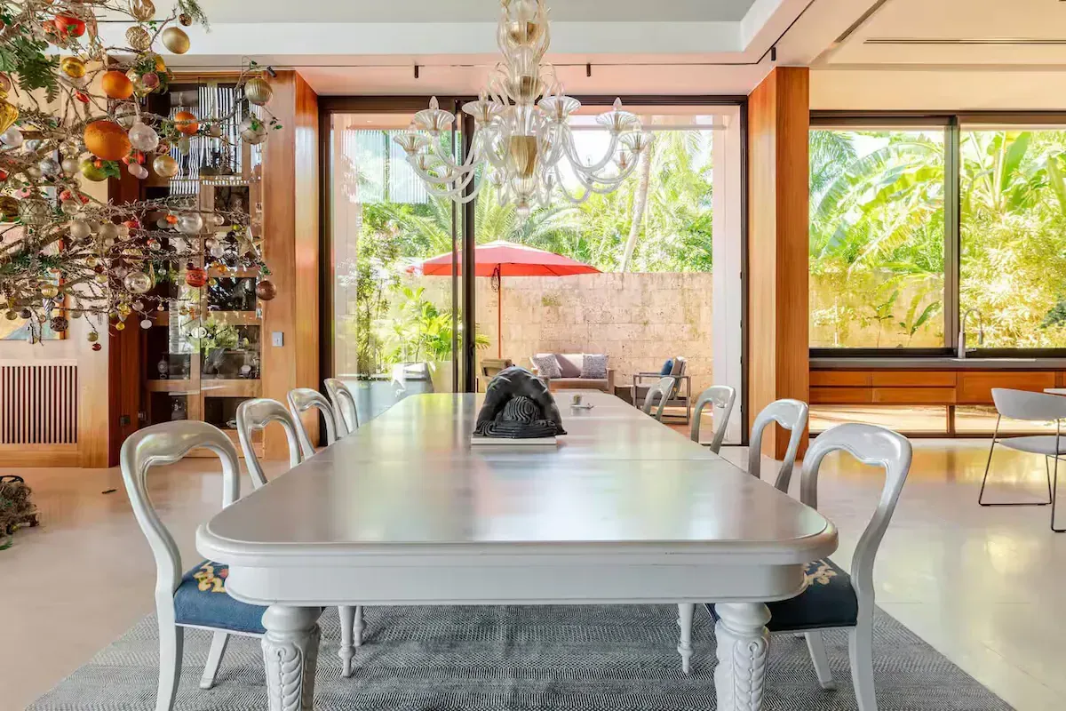 a large dining room with a long table and chairs