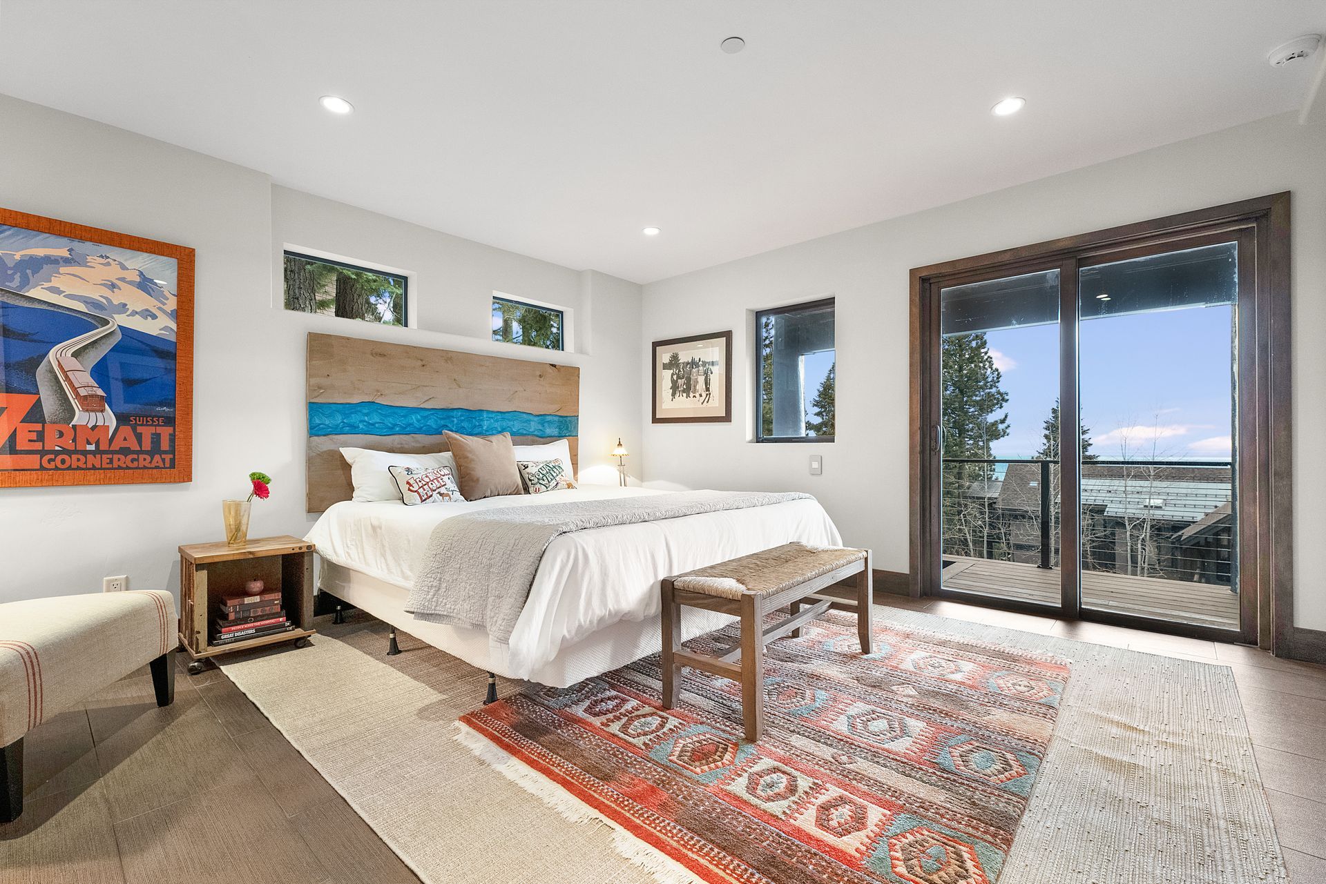 a bedroom with a large bed and a sliding glass door