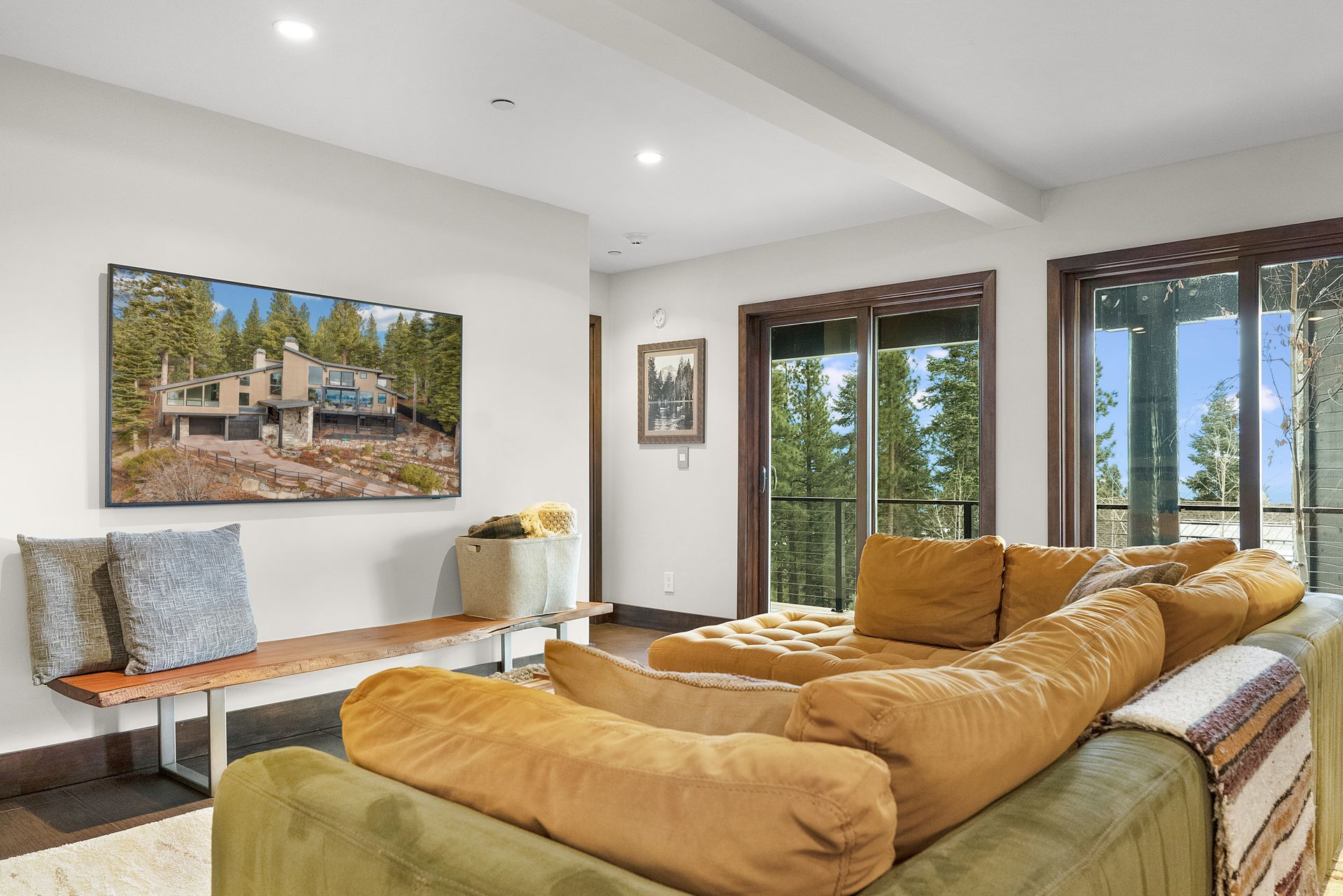 a living room with a large couch and a flat screen tv