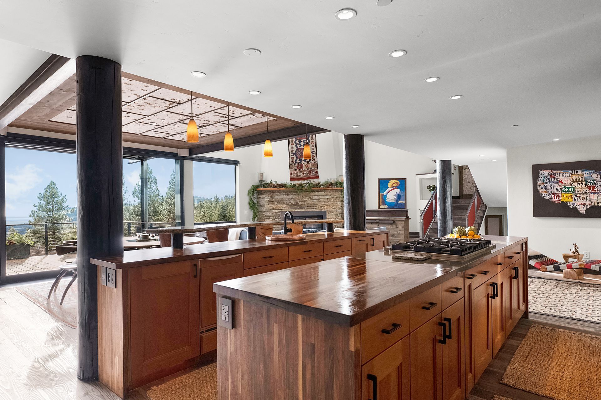 a kitchen with a large island and wooden cabinets