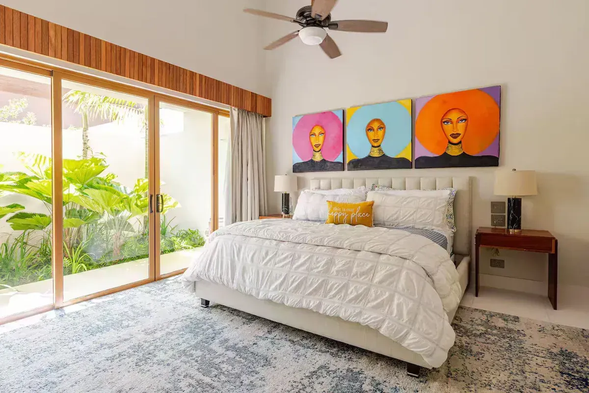 a bedroom with a bunk bed and a flat screen tv