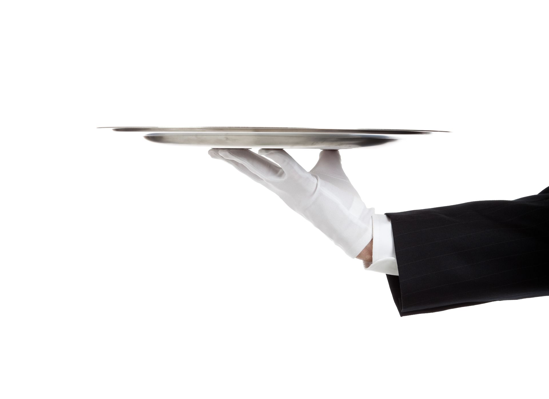 a waiter in a tuxedo and white gloves is holding a silver tray